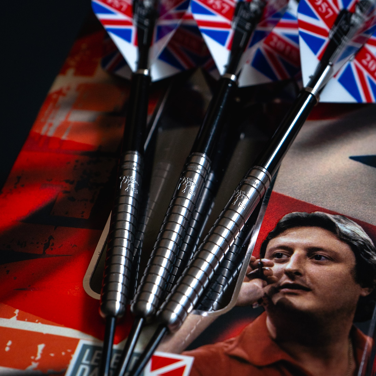 Eric Bristow Crafty Cockney darts with Union Jack flights resting on the original retail box